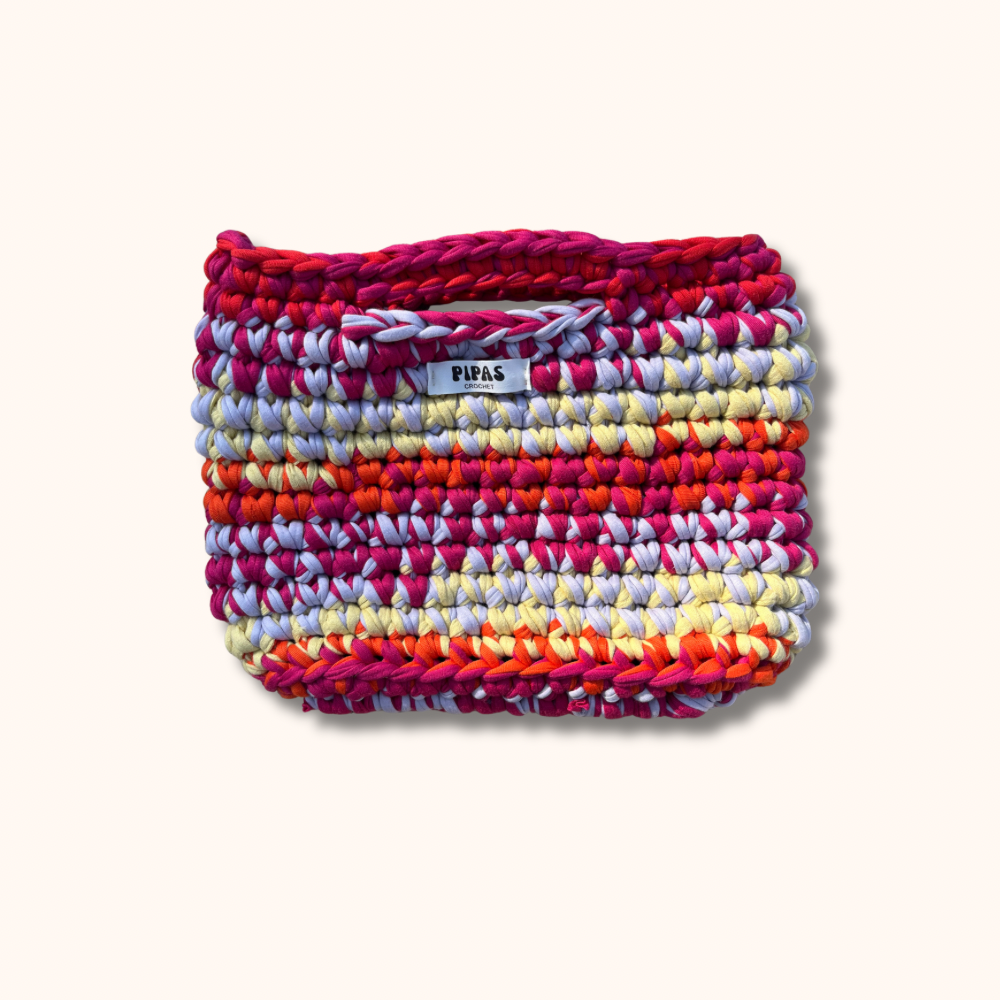 Sac Marrakech rose, rouge, lilas et jaune, détouré sur fond crème